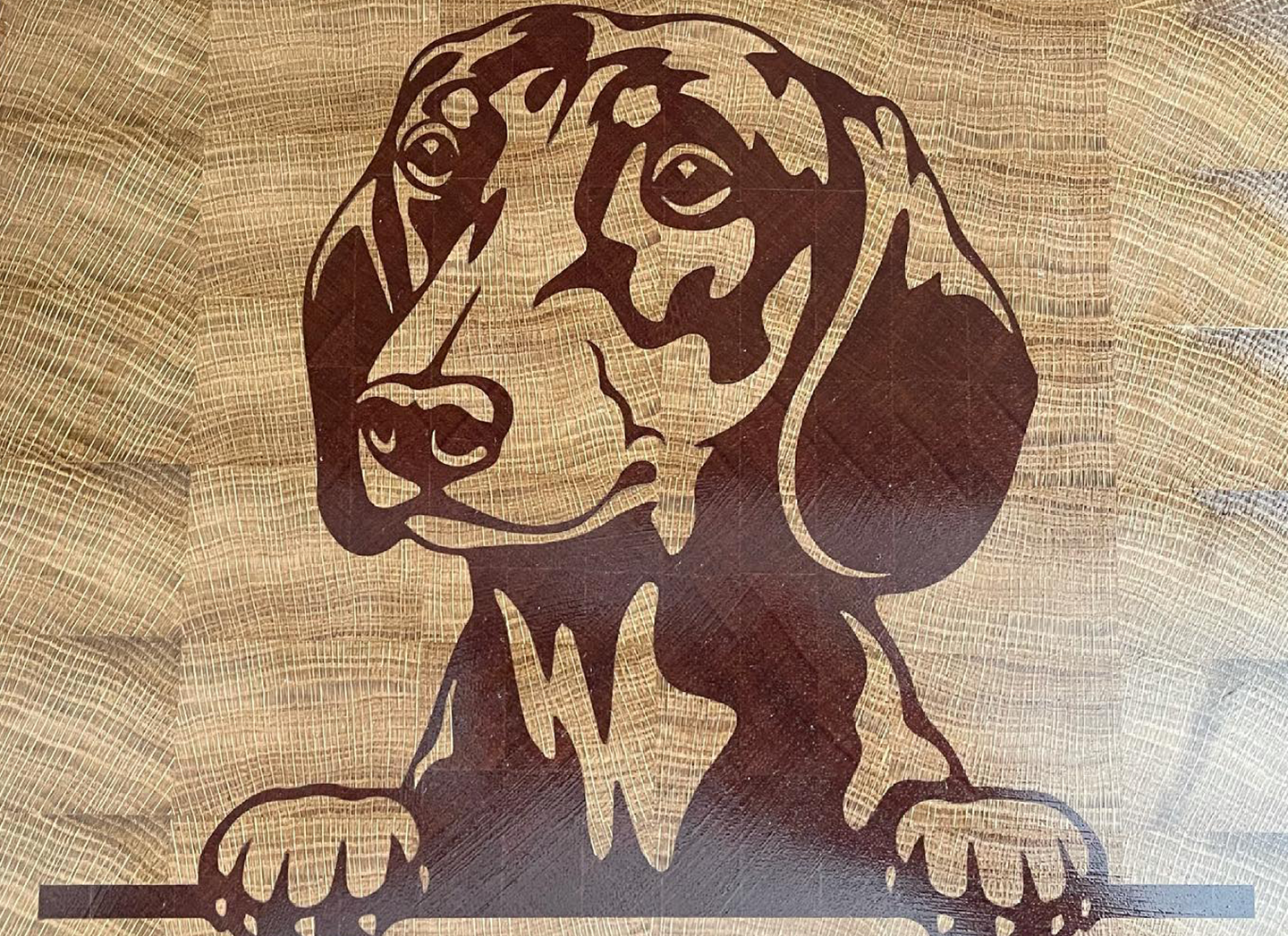 This dog chopping board was CNC machined by BHL Woodworks with Carveco