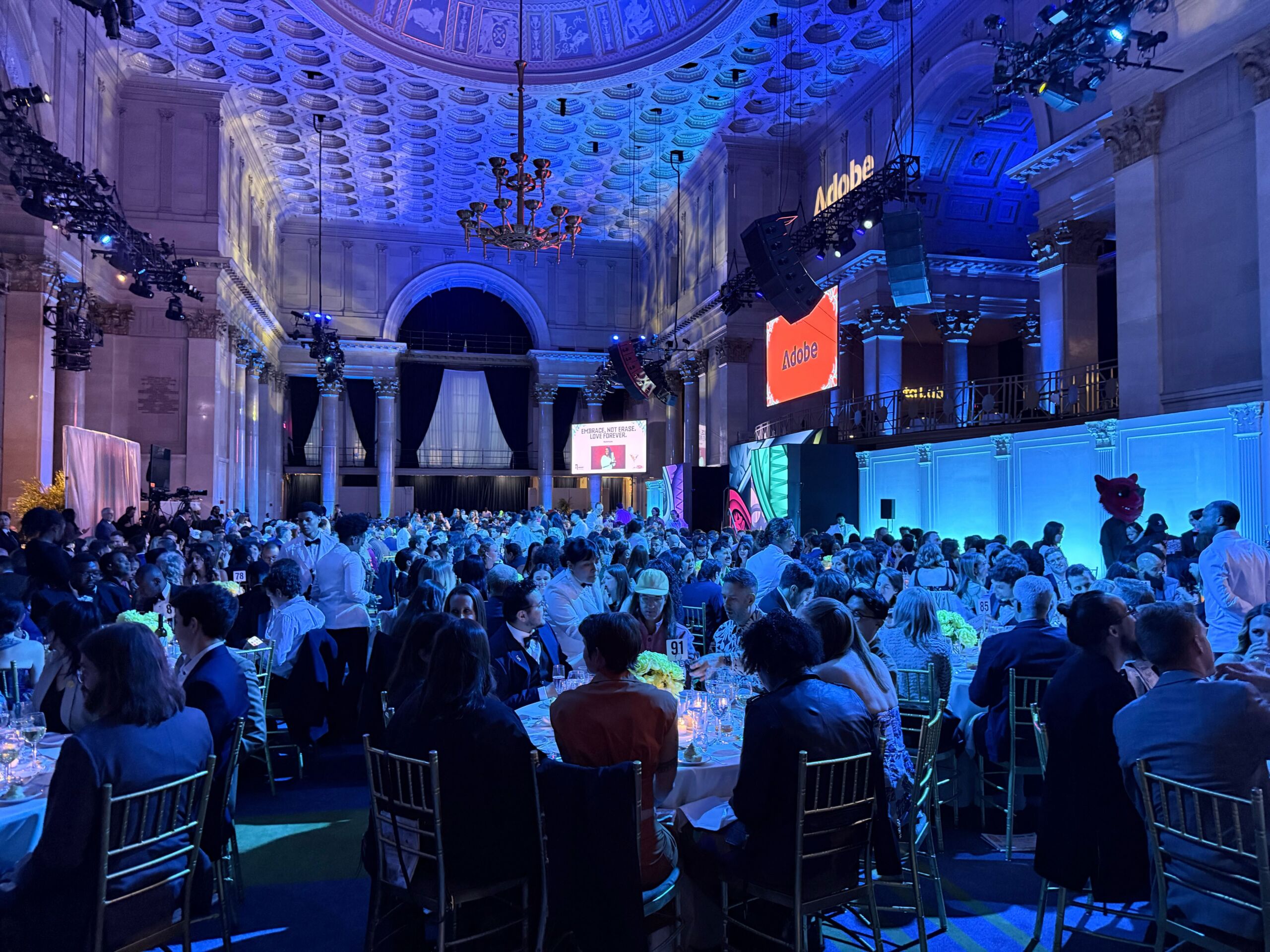 Wide view of the 30th Annual Webby Awards ceremony at Cipriani Wall Street in New York City, showing a large audience seated beneath an illuminated vaulted ceiling as presentations take place on stage.